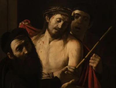 A painting by Italian master Caravaggio entitled 'Ecce Homo' is pictured at the Prado museum in Madrid, on May 27, 2024. A painting by Italian master Michelangelo Merisi da Caravaggio, known as Caravaggio, once mistakenly thought to be by an unknown artist and almost auctioned off with an opening price of 1,500 euros, has been unveiled at the Prado museum. Entitled "Ecce Homo", the dark canvas depicting a bloodied Jesus wearing a crown of thorns just before his crucifixion, is one of around only 60 known works by the Renaissance artist. (Photo by PIERRE-PHILIPPE MARCOU / AFP) / RESTRICTED TO EDITORIAL USE - MANDATORY MENTION OF THE ARTIST UPON PUBLICATION - TO ILLUSTRATE THE EVENT AS SPECIFIED IN THE CAPTION