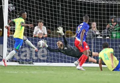 USA's goalkeeper #01 Matt Turner saves a goal headed by Brazil's defender #04 Marquinhos (R) in the 95th minute of the Continental Clasico 2024 international friendly football match between USA and Brazil at the Camping World Stadium in Orlando, Florida, June 12, 2024. (Photo by Gregg Newton / AFP)